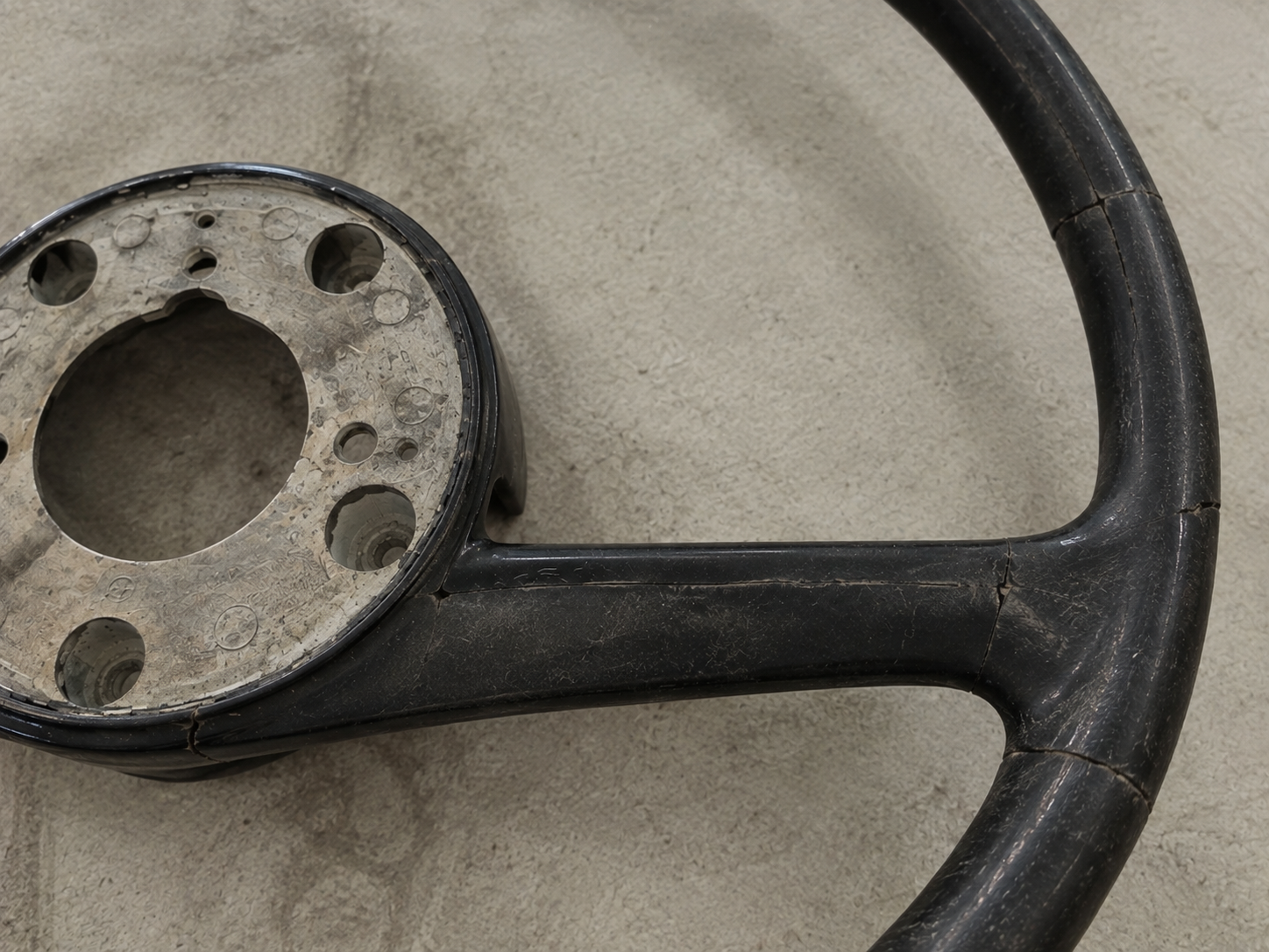 A damaged and heavily aged vintage Bakelite component before undergoing a meticulous resurrection process by Pride Car Customs.